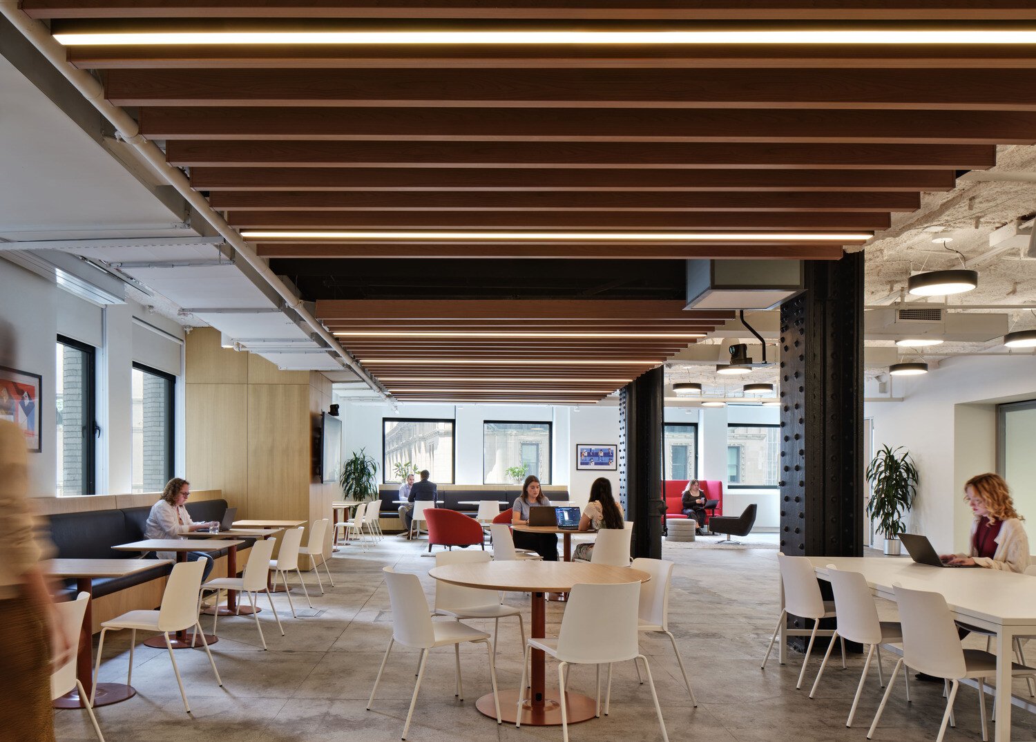 employees sitting at tables working