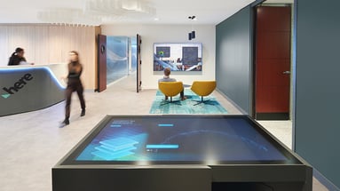 Woman walking with interactive screen in foreground